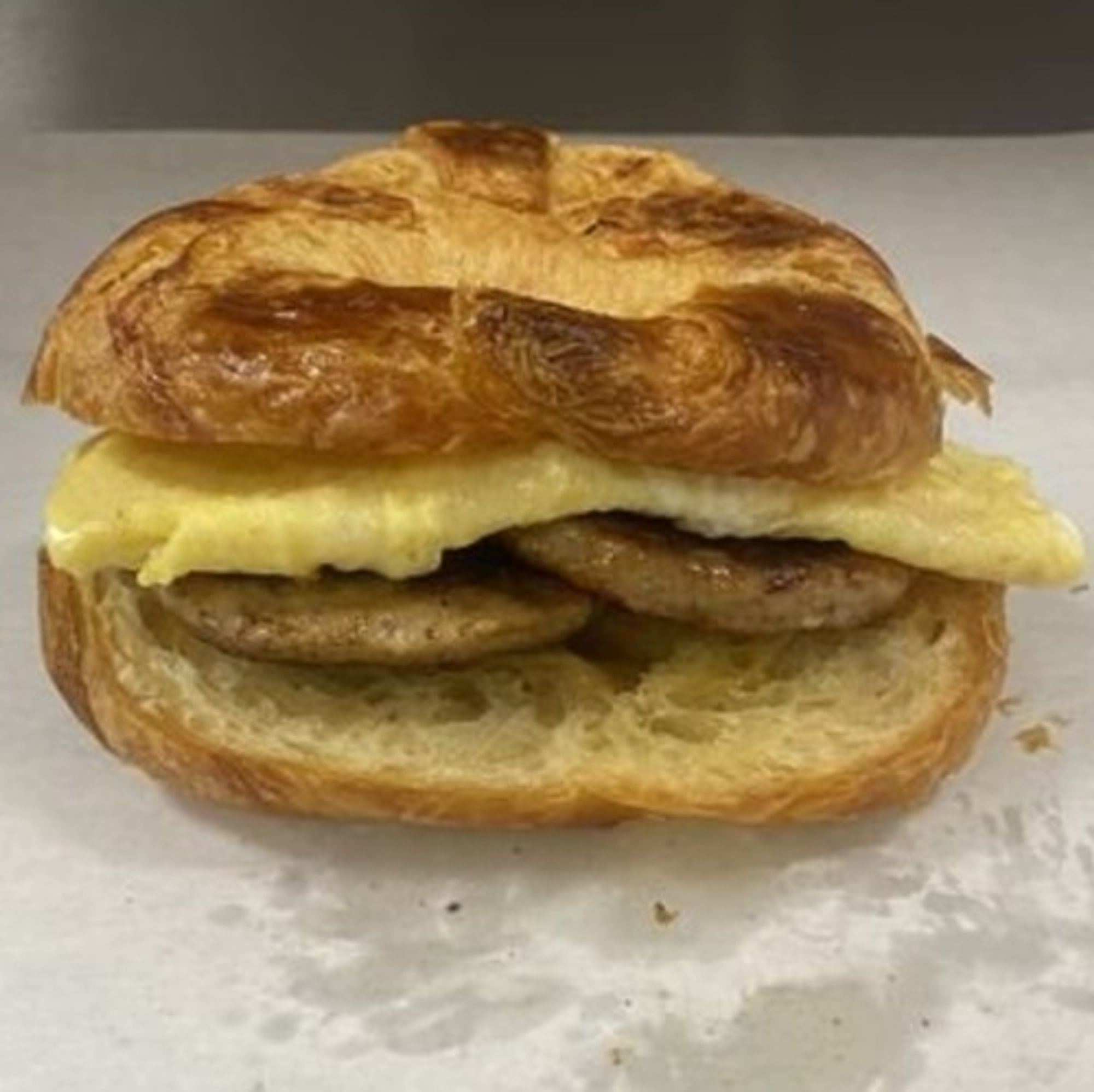 Egg and Ham, Bacon, Or Sausage on Croissant