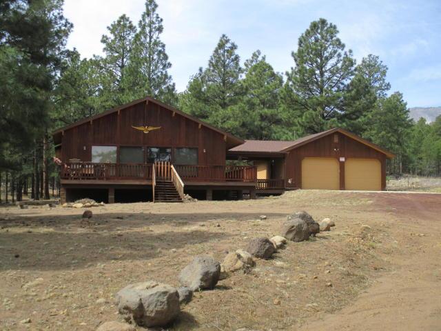 This Gorgeous forest retreat offers five acres of pristine treed land that borders forest service. This beautiful bright & sunny home offers an open concept great room with vaulted tongue & groove ceilings and vast array of windows to enjoy the panoramic views of the forest that surrounds. The bedrooms are a very nice size and the master has a large walk in closet. This great home offers a covered deck/breeze way to the detached garage.