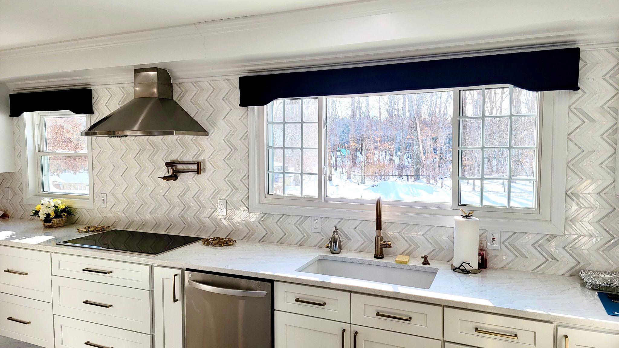 Navy top treatments are a beautiful contrast piece for this kitchen in Freehold,NJ