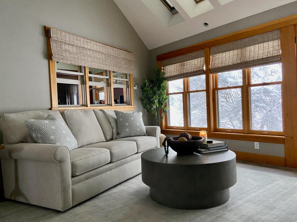 Create a warm and inviting atmosphere in your home, like the one in this living room in Rutland, Massachusetts! The perfect window treatment for the cozy and stylish homeowner. Our shades add a touch of nature and texture to your deÌcor, bringing the outdoors inside.