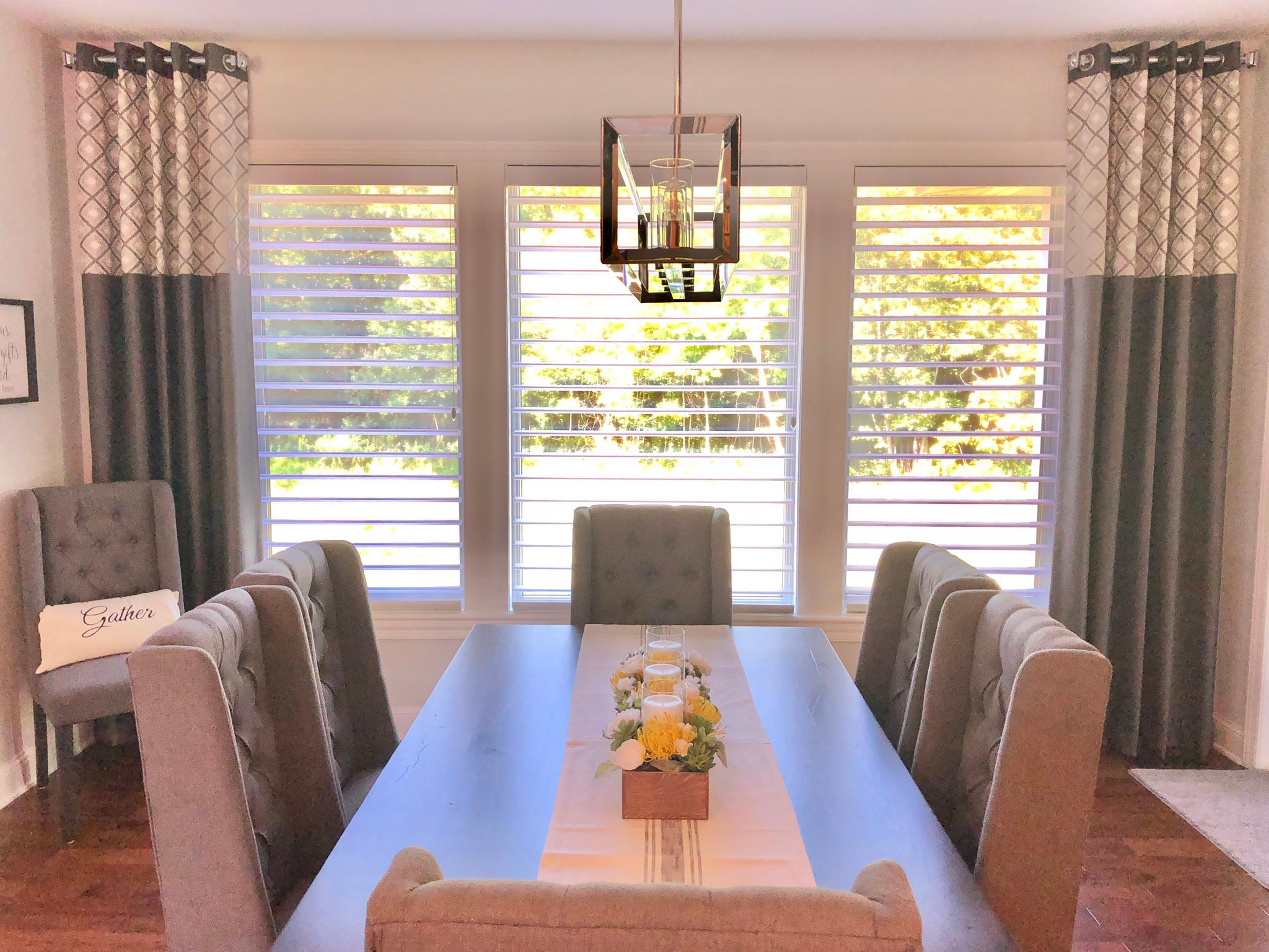 We  love these custom stationary drapes with a color block that we installed in this Norwood Young America dining area!