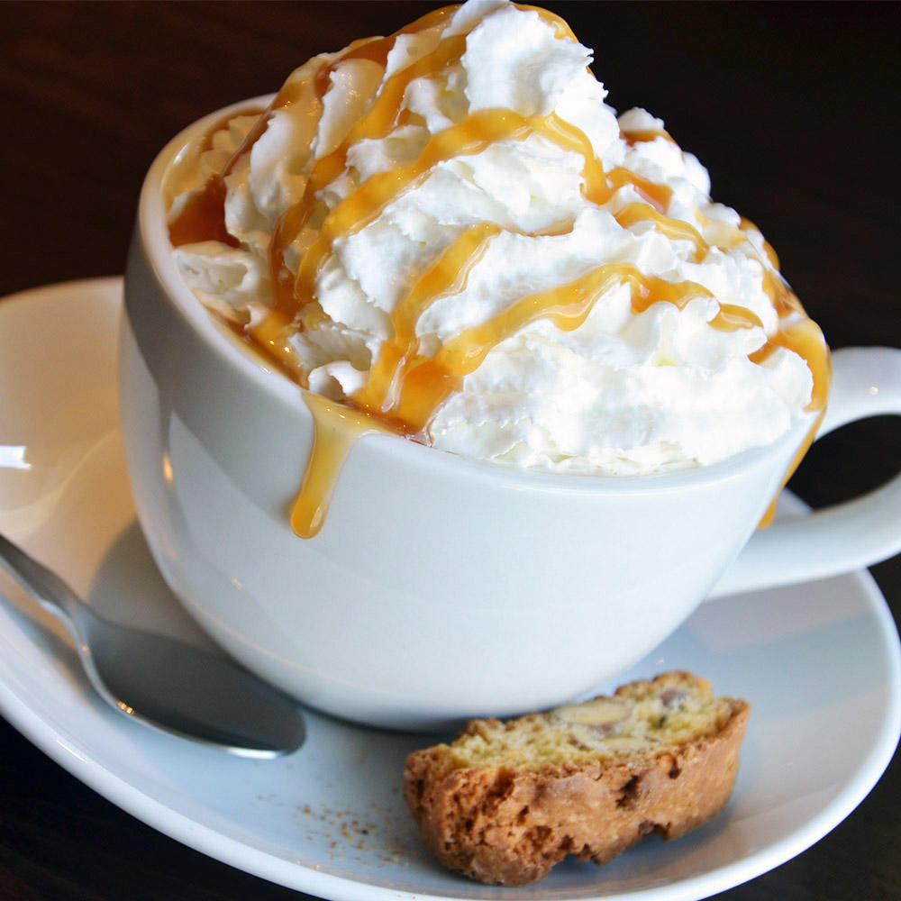 Cappuccino: Lavazza Espresso and steamed milk, topped with whipped cream and a sprinkle of cinnamon.