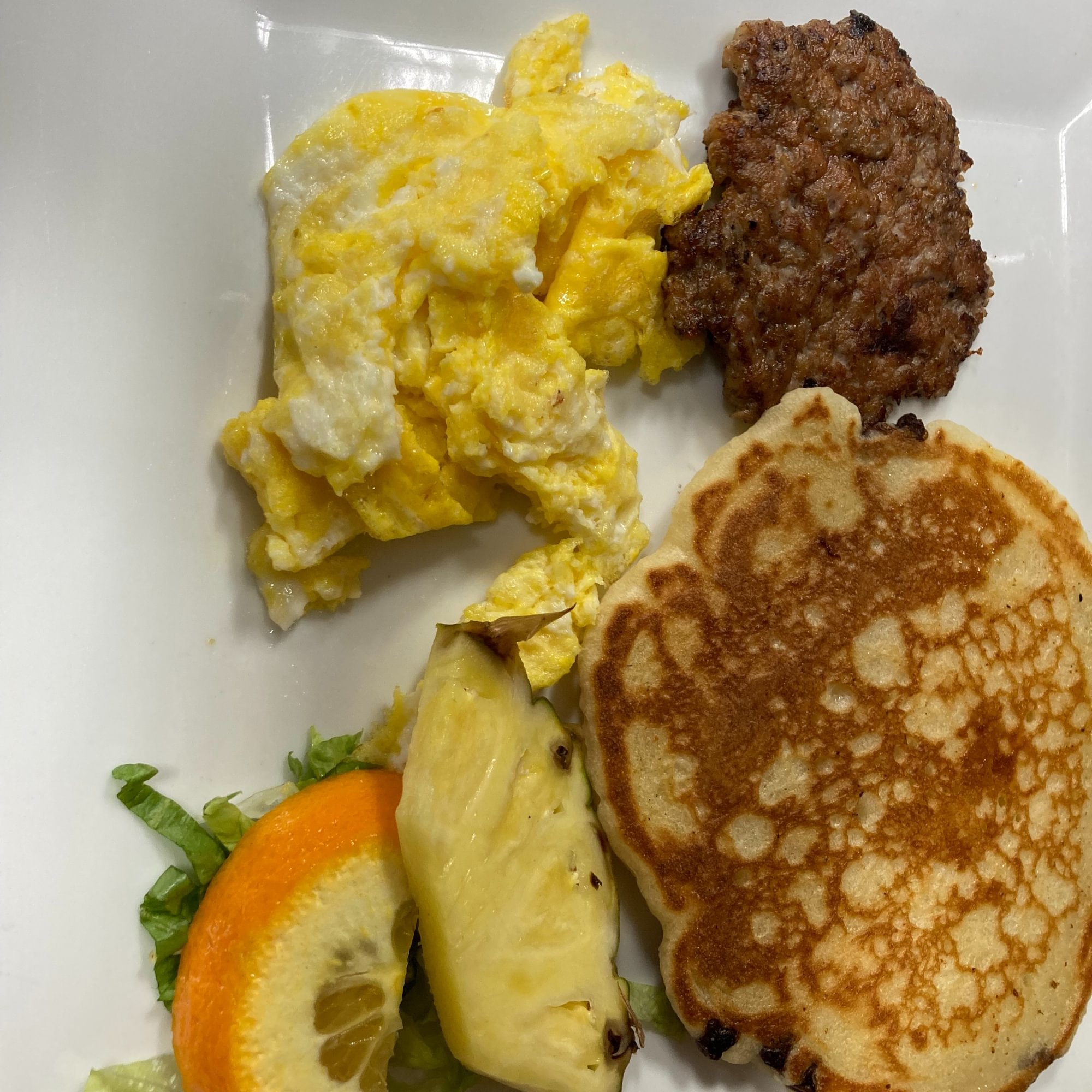 1 Scrambled Egg, 1 Kids Pancake, 1 Piece of Bacon or Sausage