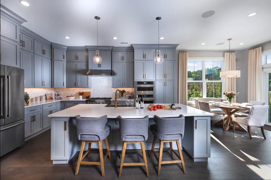 Gorgeous kitchens with large center islands, brand-named stainless steel appliances, and granite countertops