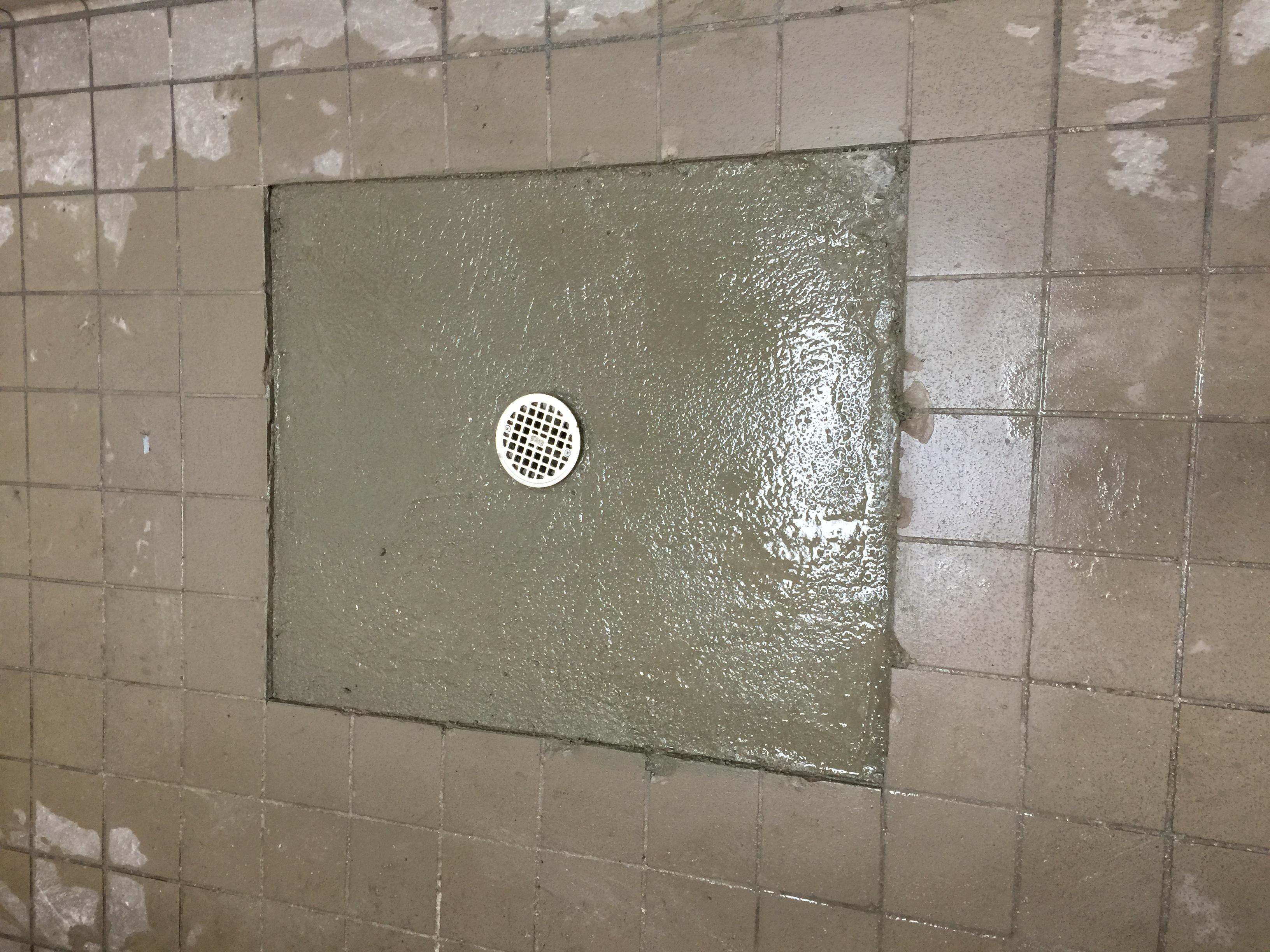 Replaced floor drain with p-trap and concrete patch