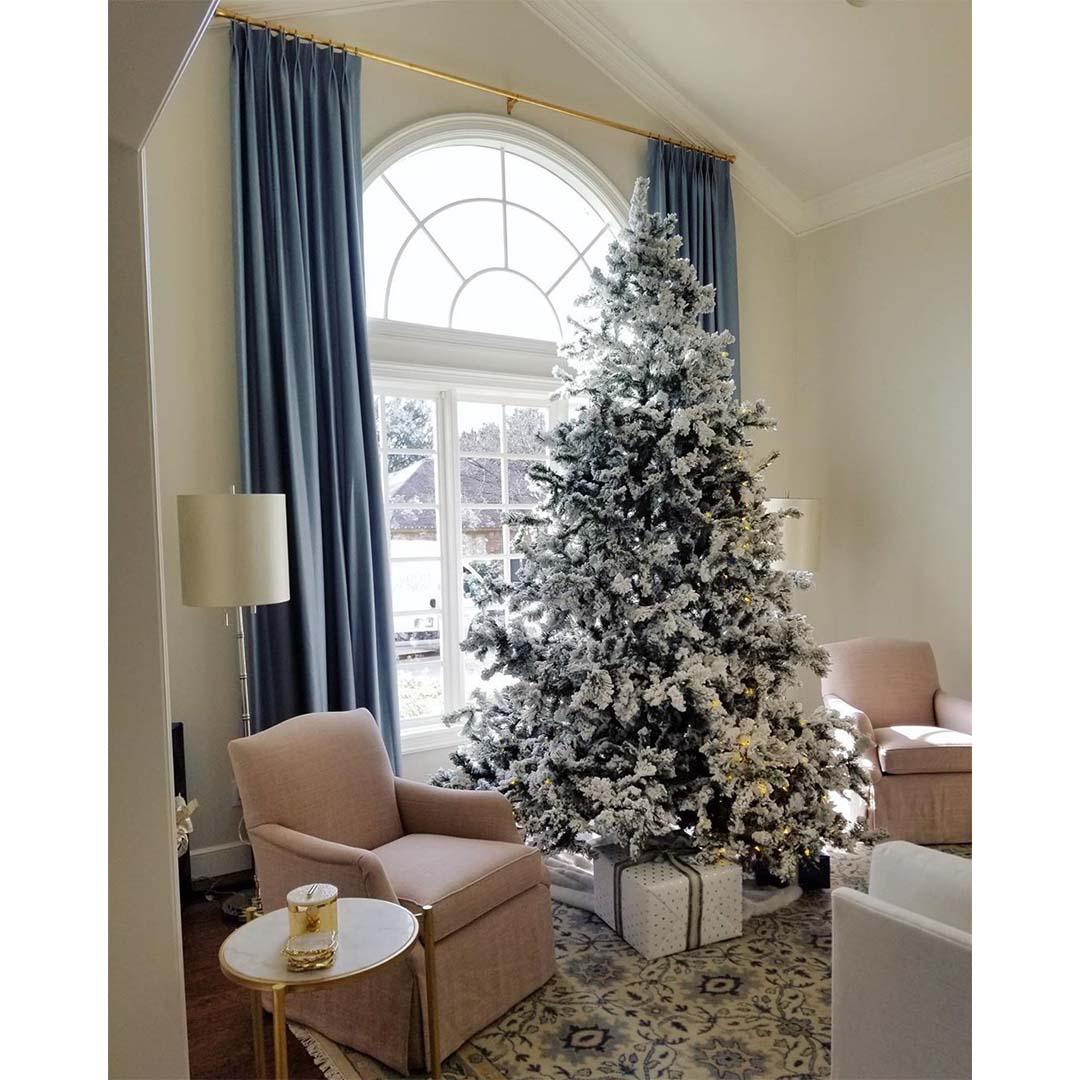 Walk into a winter wonderland with gorgeous floor-to-ceiling draperies from your local Budget Blinds.