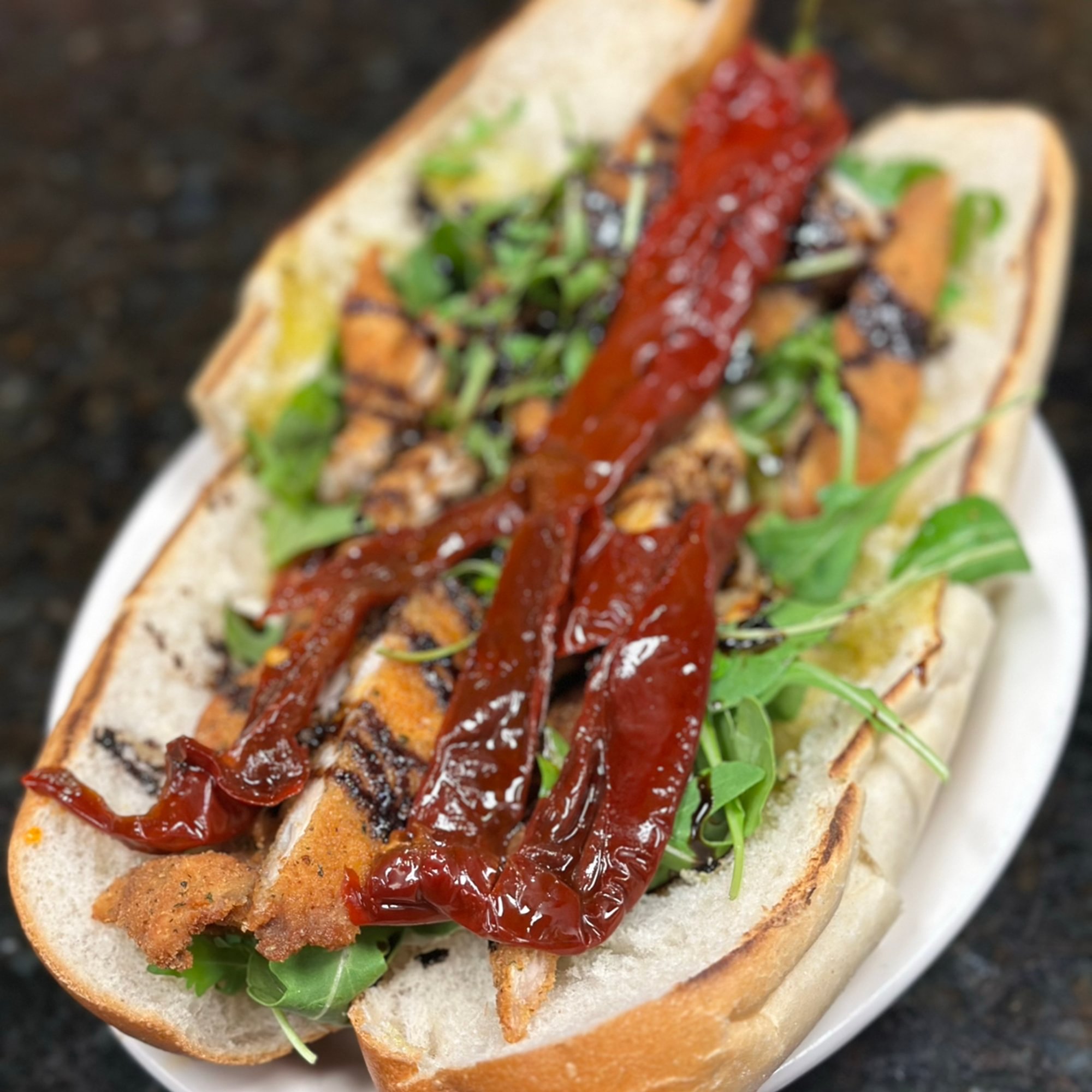 New Chicken Hero fresh Mozzarella, Sundried Peppers, Arugula, Balsamic Glaze