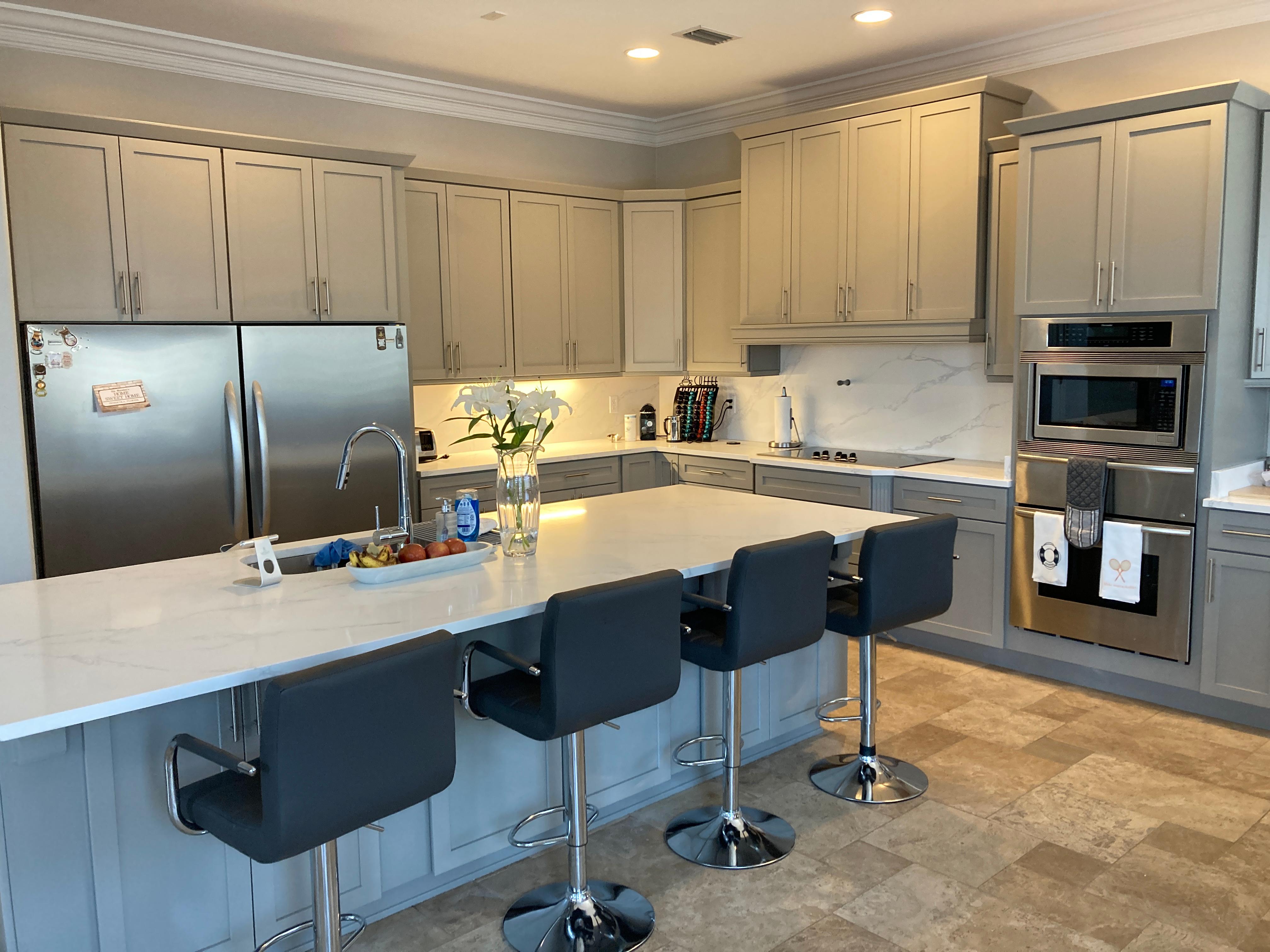 Kitchen Tune-up updated this kitchen with a redoor in a grey tone called 