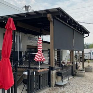 These exterior solar shades were installed to a Lander restaurants patios to provide protection from the sun's powerful heat and strong UV rays.