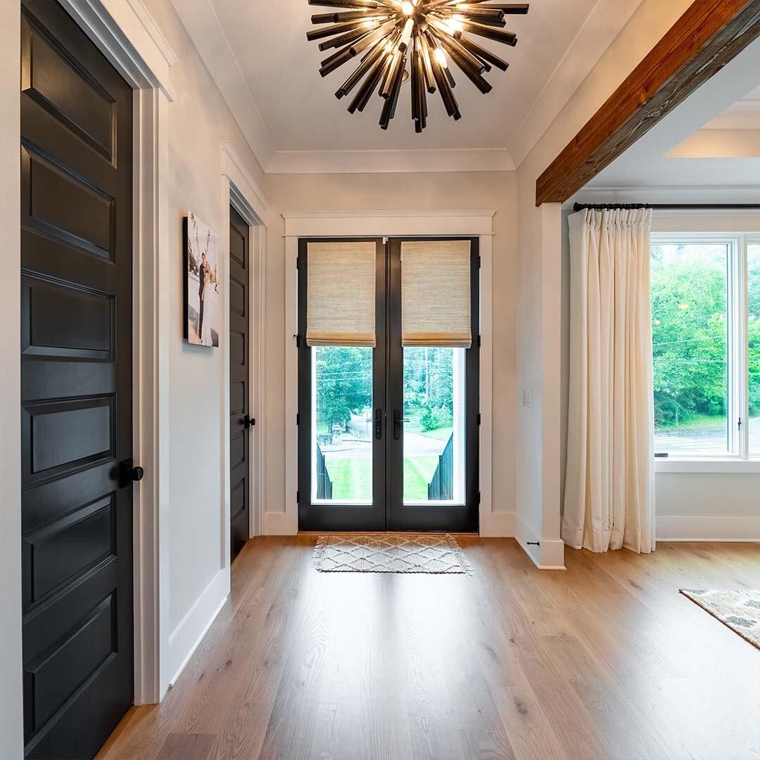 Are Roman shades a good choice for French doors? Absolutely! The soft fabric of these woven Roman shades allow them to not clatter against the door when opened or closed, and they can add texture and privacy. Think Roman shades may be right for your home? Contact us for a free in-home consultation!