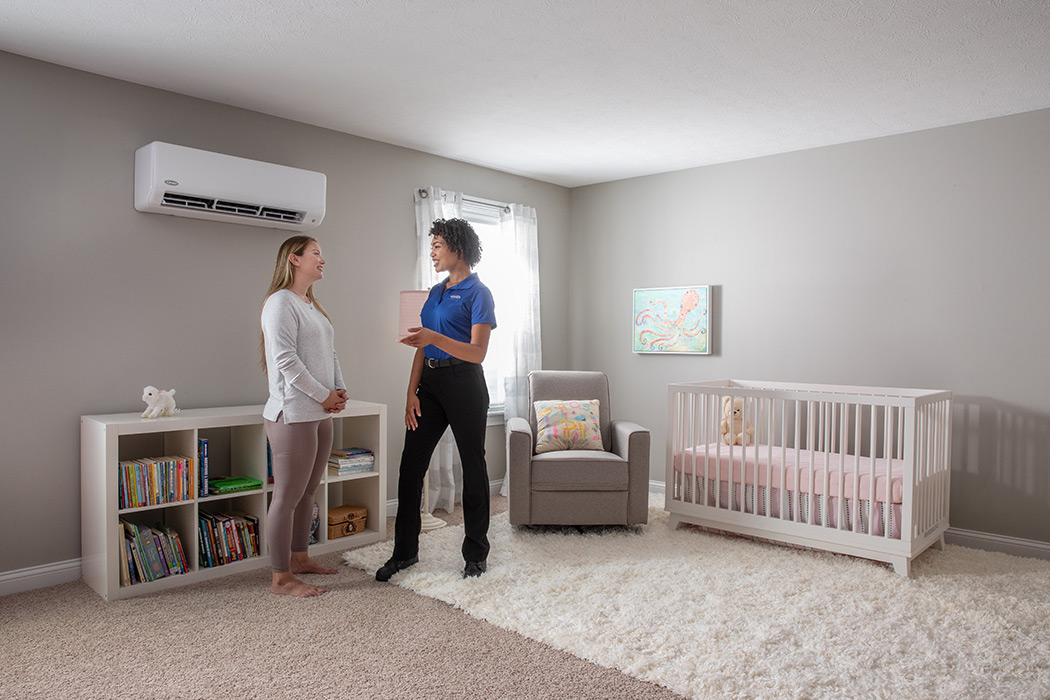 A ductless mini split installation outside of a brick home
