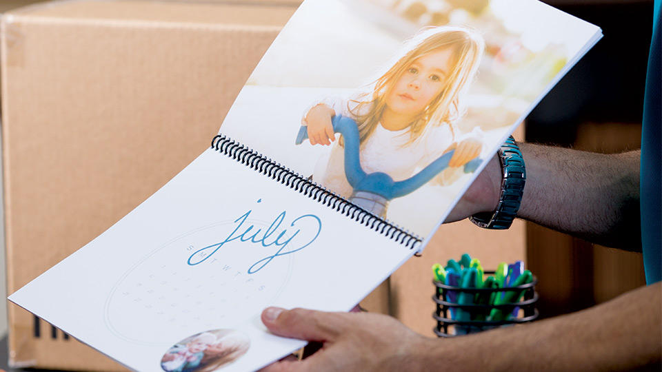 calendar being shown to customer inside the ups store