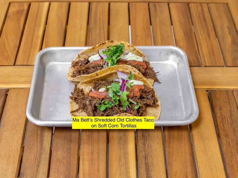 Ma Bett's Ropa Vieja Brisket Tacos, zhug mayo, roasted tomato salsa, pickled red onions, cilantro