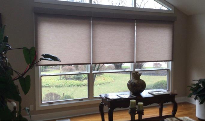 Automated Lutron Roller Shades from Budget Blinds of Phillipsburg instantly upgraded this elegant room by adding privacy and glare control with a simple touch of a button!