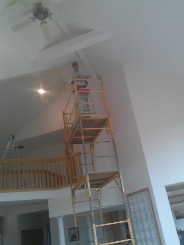 Here is Ray, working on scaffolding- the only option for repair and painting of this ceiling.