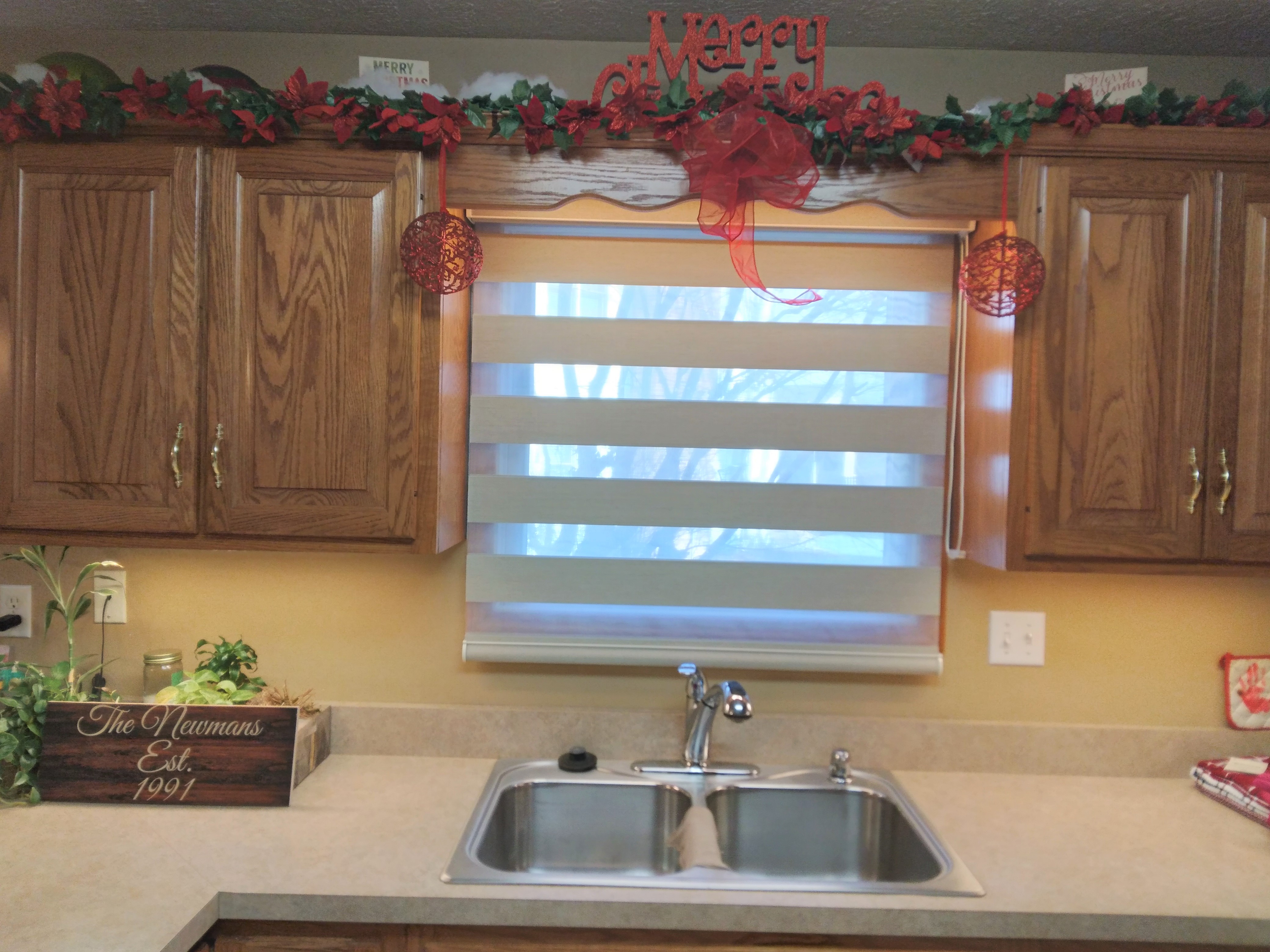 Dual shades/zebra shades in Springfield Illinois kitchen.   BudgetBlinds  WindowCoverings  Shades