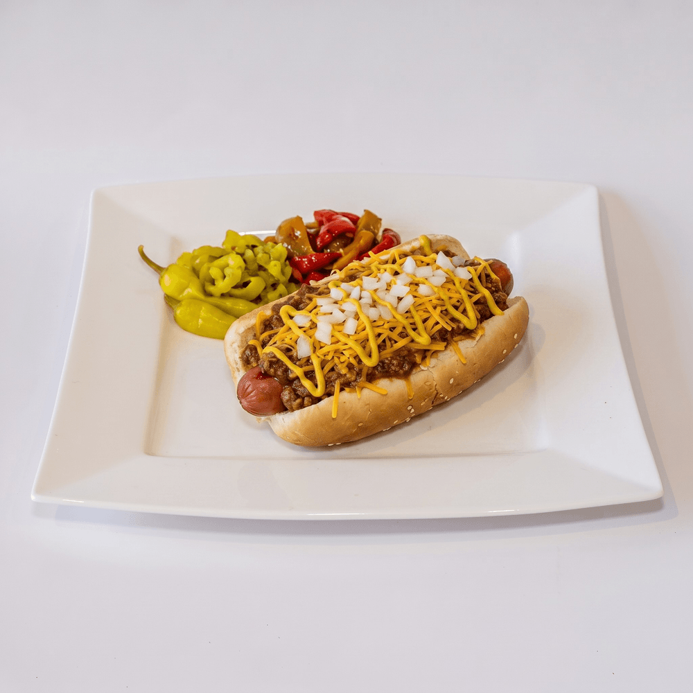 Barbara Lee (Chili Dog, Extra Cheese, Raw Chopped Onion on Top, & Mustard)