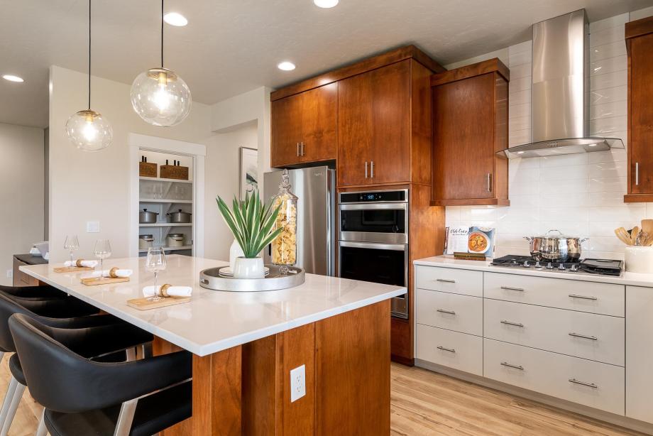 Open kitchen with two-toned cabinets