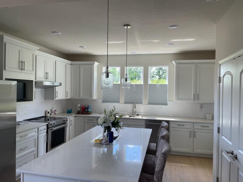 Sometimes you want privacy, and sometimes you want to look outside-that's why our Top-Down, Bottom-Up Cellular Shades are perfect in this Plainfield kitchen!