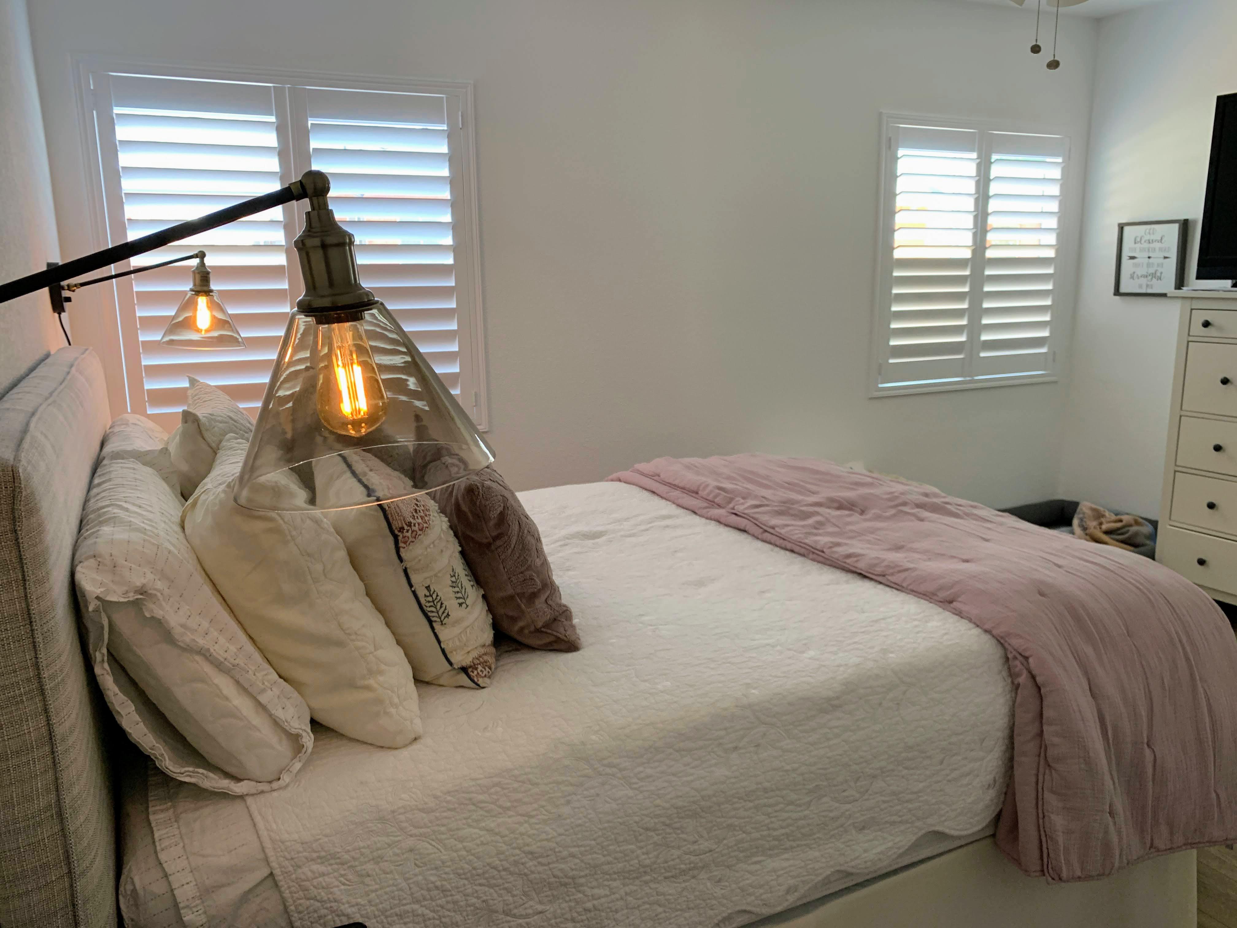 Composite wood shutters with invisible tilt (no center bar), and split tilt for privacy and light control. Installed in this beautiful home in Long Beach.