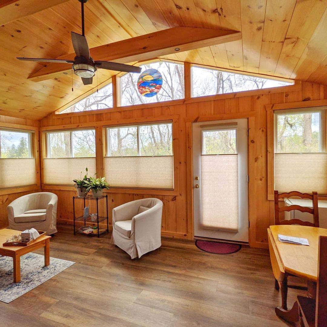 Beautiful honeycomb shades in this woodsy cabin!