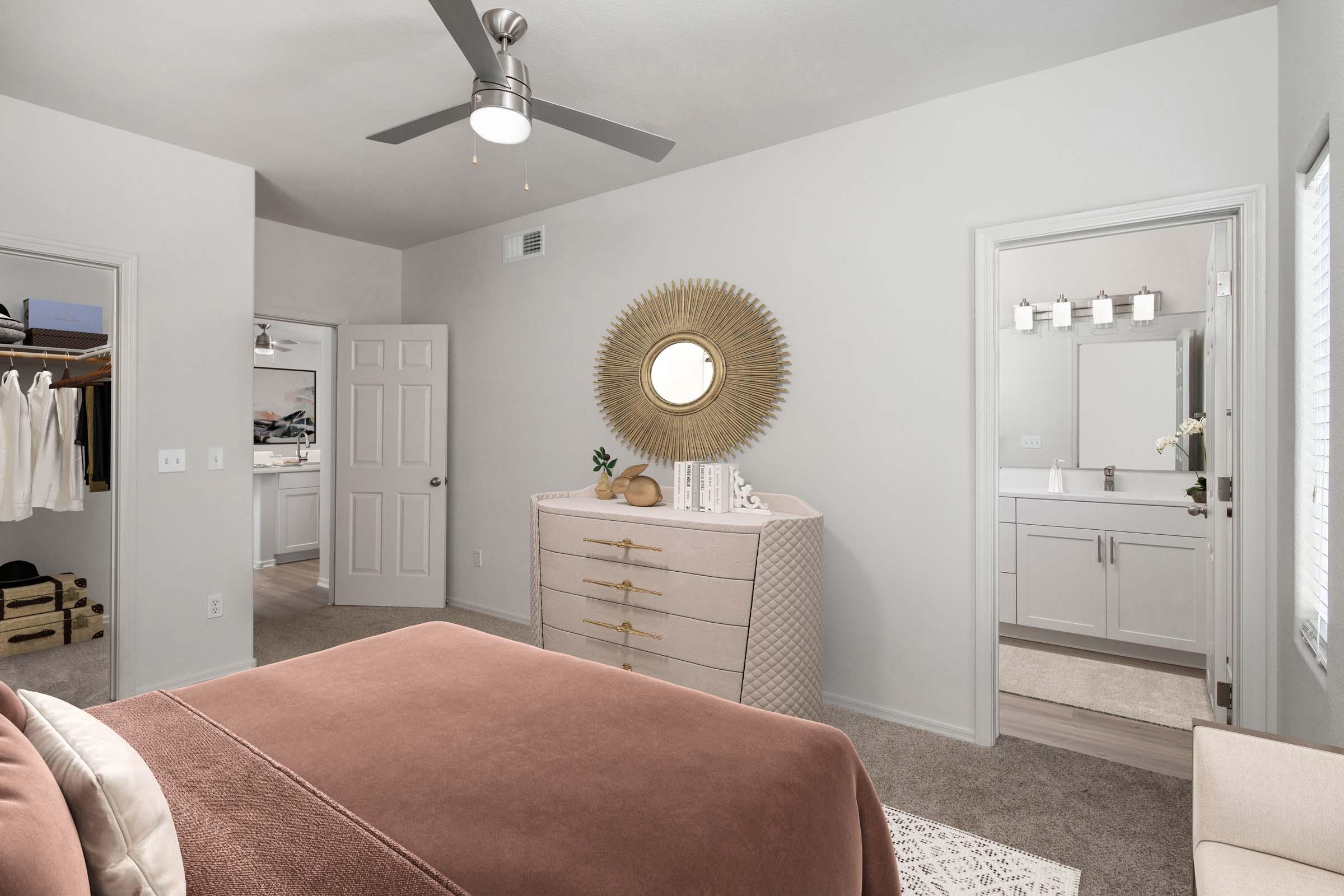 Bedroom with ensuite bathroom and ceiling fan