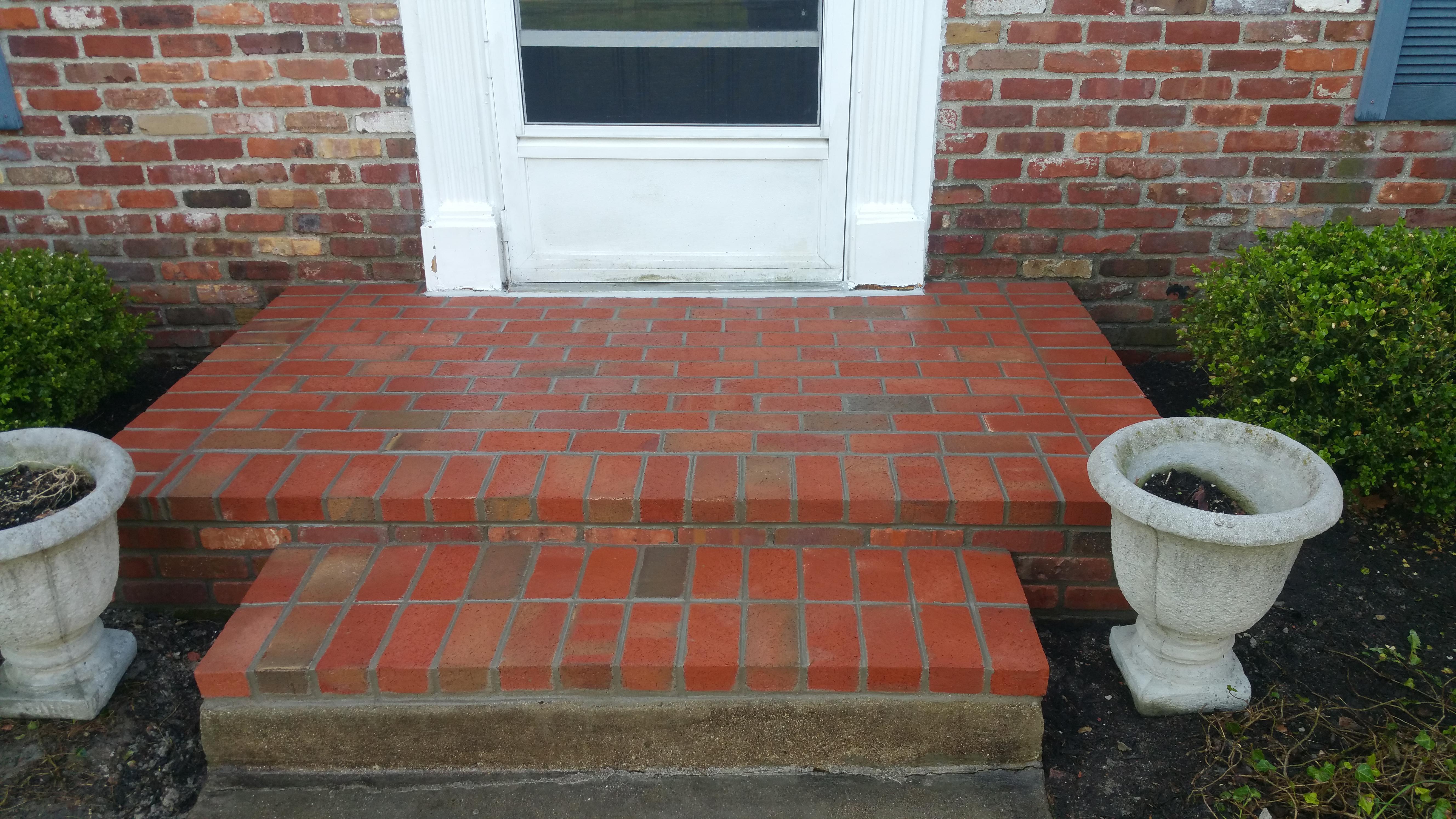 We removed the top and sides of this porch just leaving the fill in place, and laid new brick all the way around and on top. We washed all the new masonry and sealed it with a 10 year breathable masonry sealer.