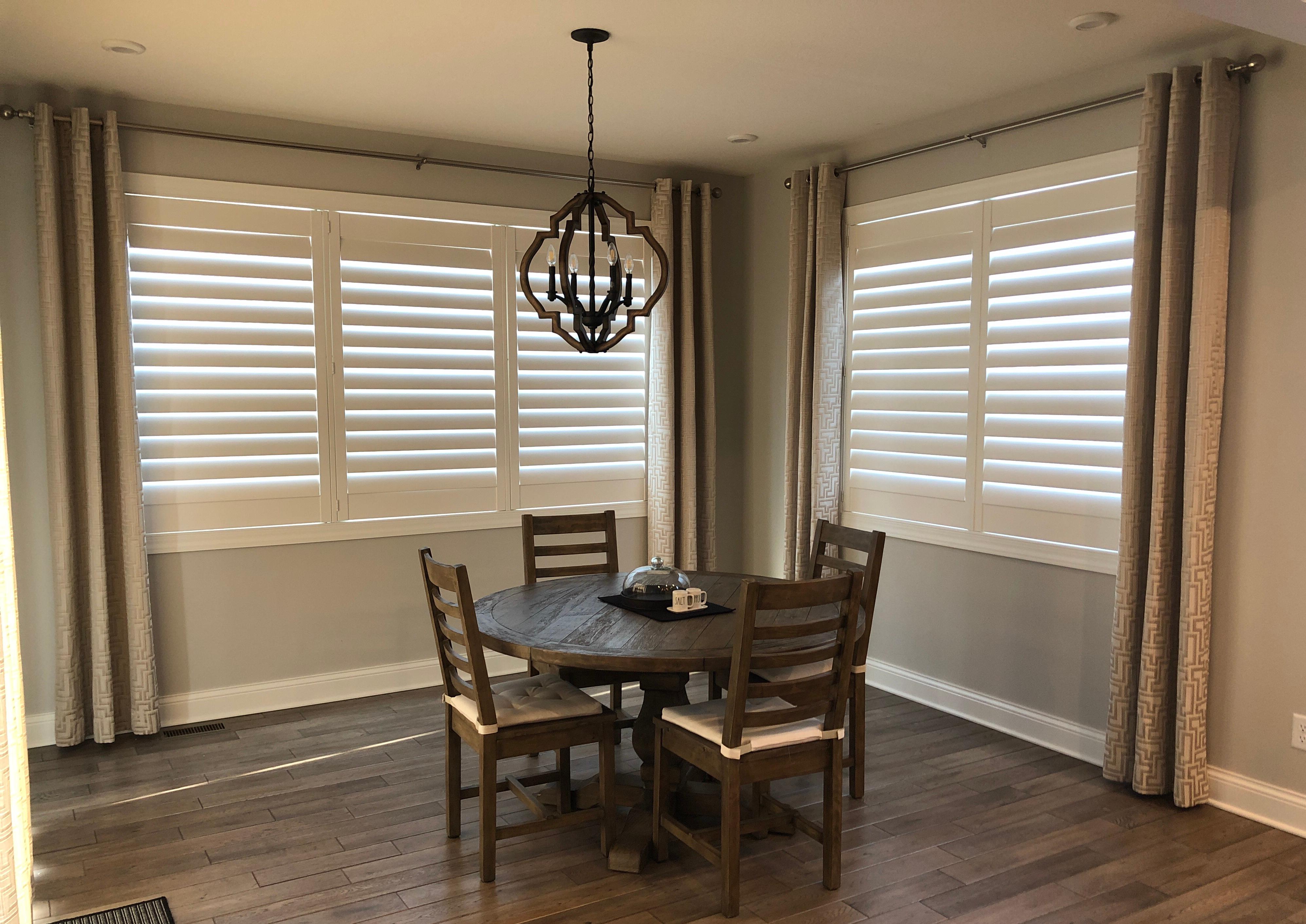 Combining stationary panels and shutters adds classic appeal to any space.