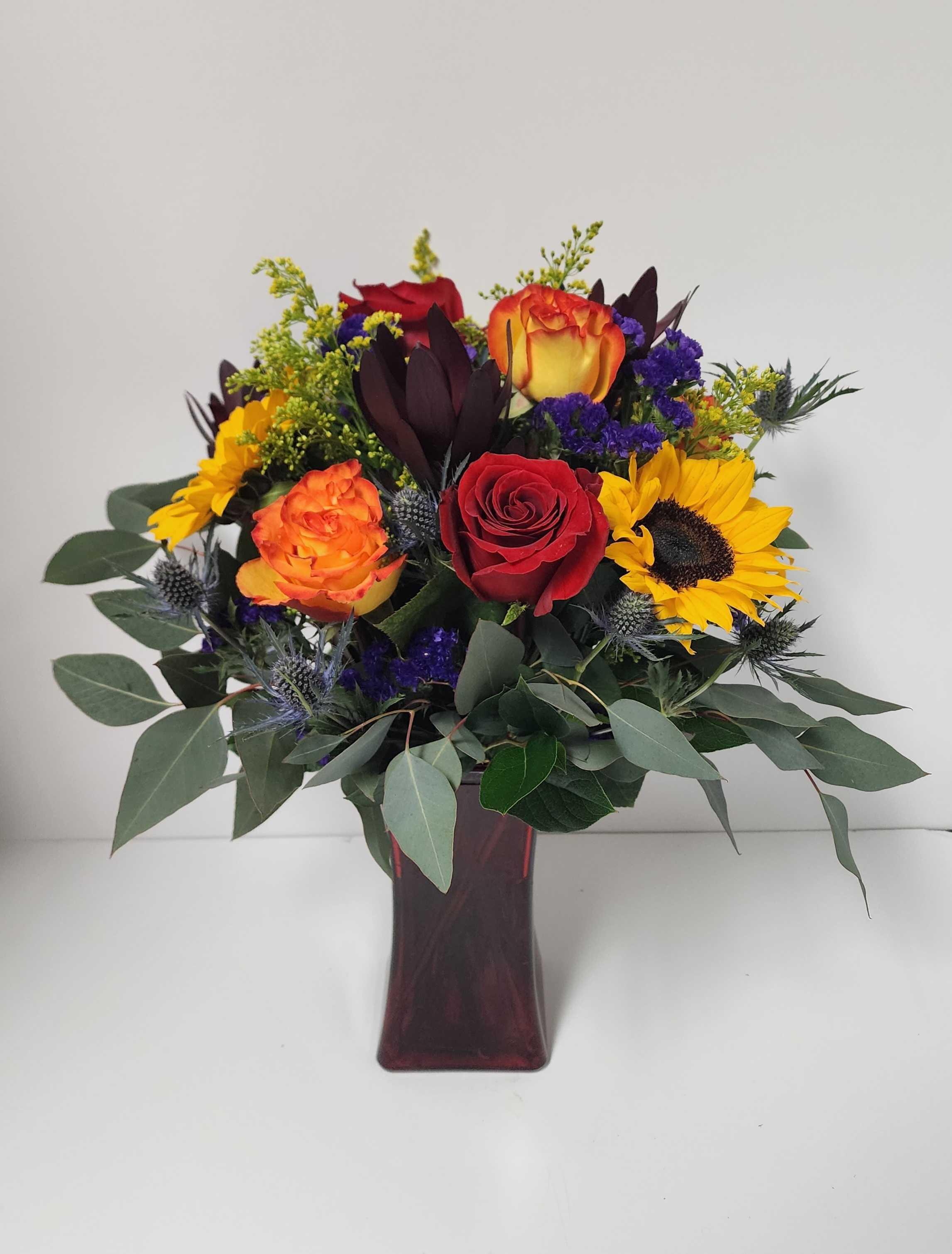 rose and sunflower arrangement by Country Greenery at The Galleria