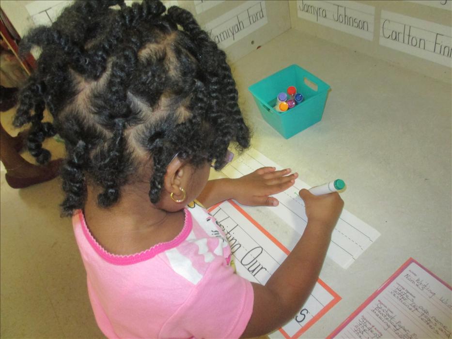 Writing our name in the writing center