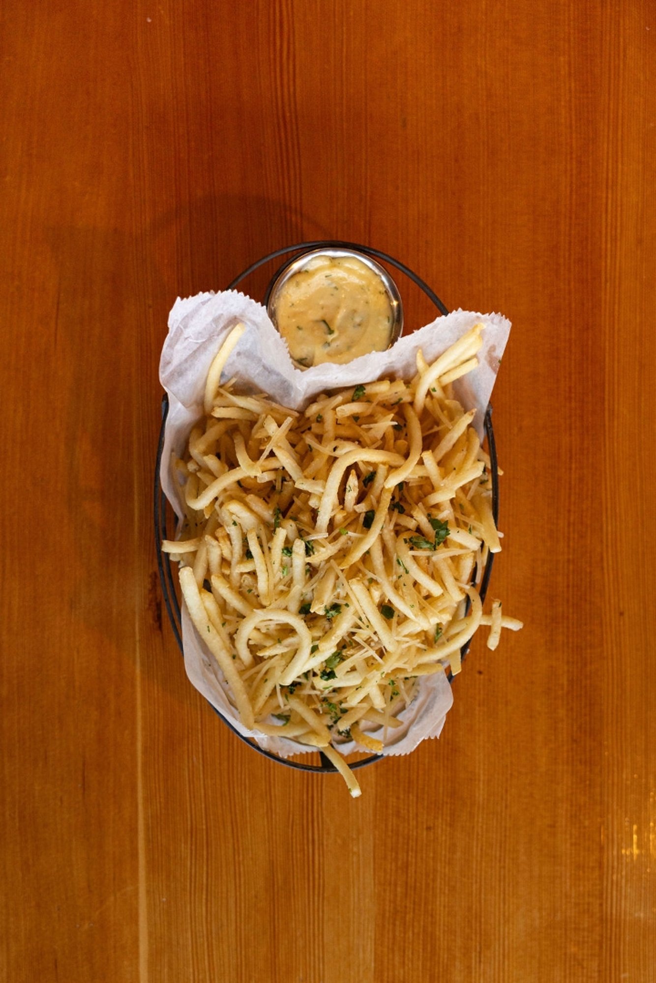 Basket of Garlic-Truffled Parmesan Frites (d)