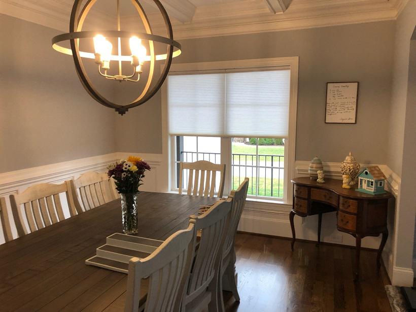 We love how our Cellular Shades enhance the lighting decor in this dining room in Plainfield. These Shades offer a unique minimalist aesthetic making them perfect for any room.