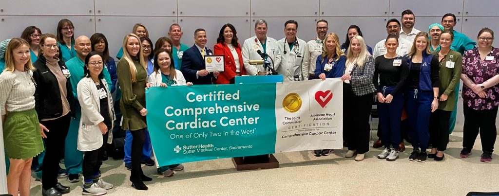 Heart team with banner for certification.