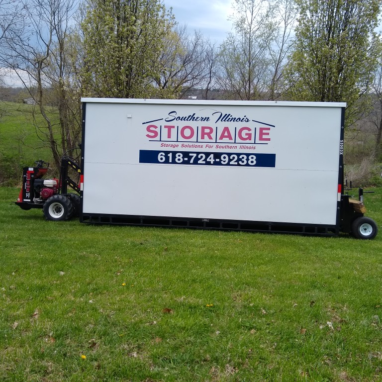 Portable Storage Containers rolling easley across the nice green grass. Call Aaron Eubanks 6187249238