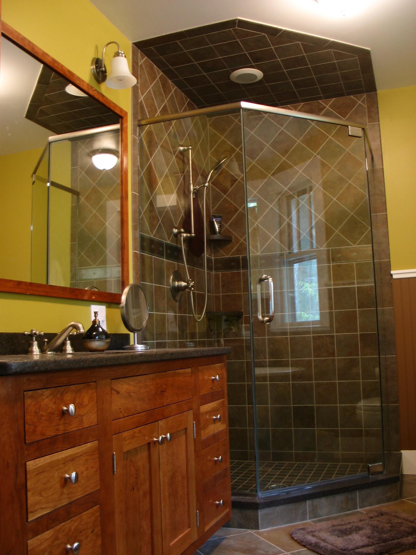 Class shower enclosure with custom made vanity cabinet