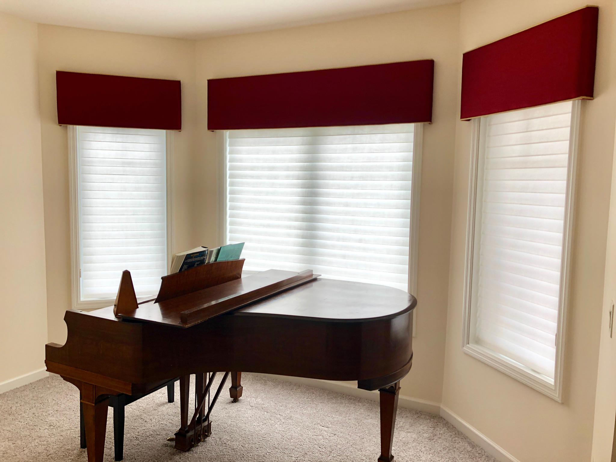 Our Carver client selected sheer shadings and simple top treatments in a bold color to add a dramatic visual element to this space.