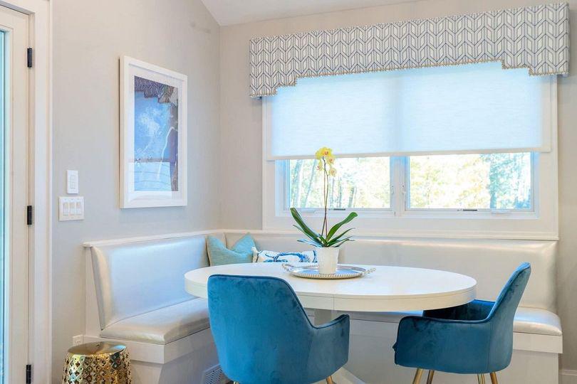 This is the perfect place to have a cup of morning coffee...We added an automated Lutron shade for sun control and topped it off with nailhead cornice.