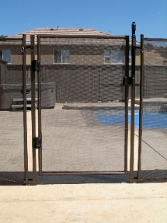 The Katchakid pool fence in 5ft height, antique bronze color option .