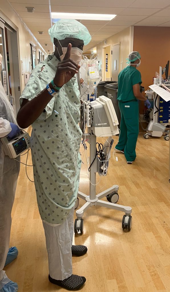 Heart transplant patient Dave Ford gets ready for a walk around the unit floor.