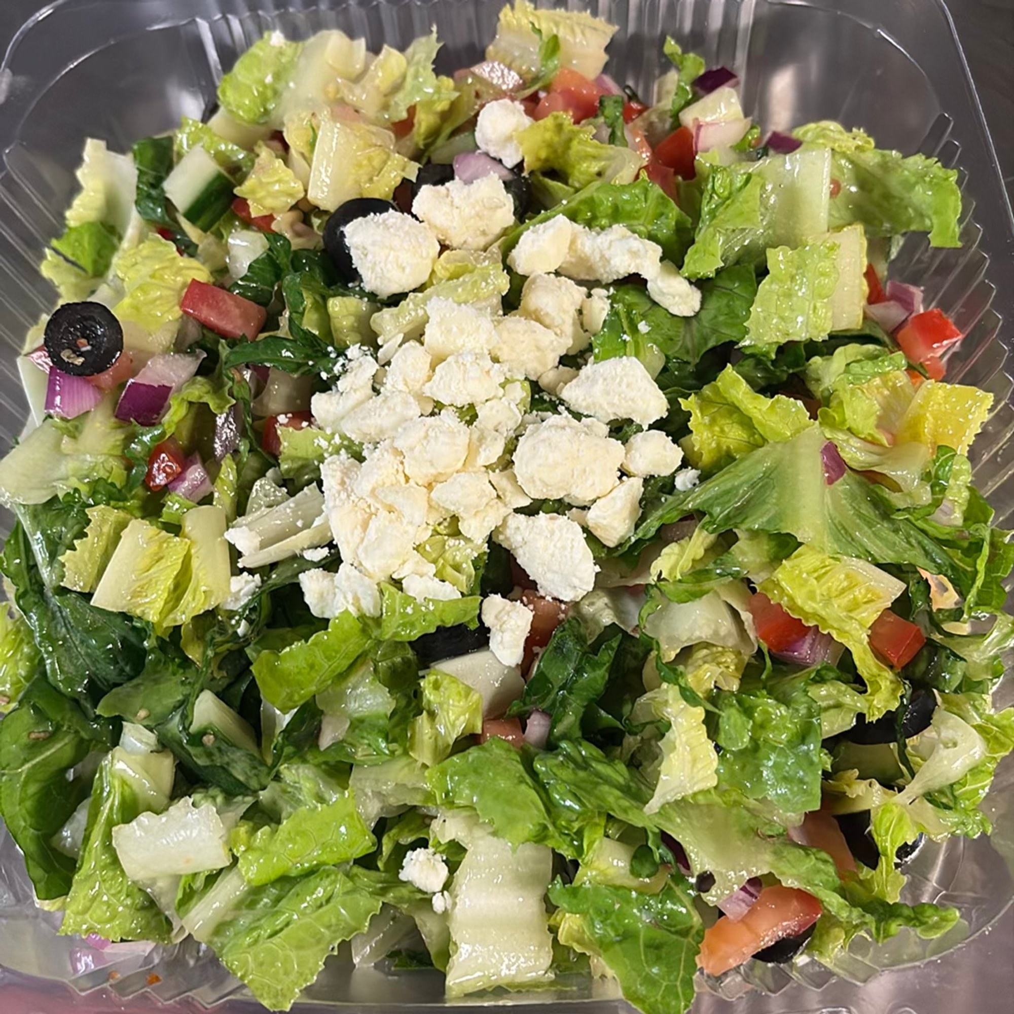 Greek Salad -- (Lettuce, Onions, Tomato, Cucumber, B Olives, and Feta with Greek Dressing)