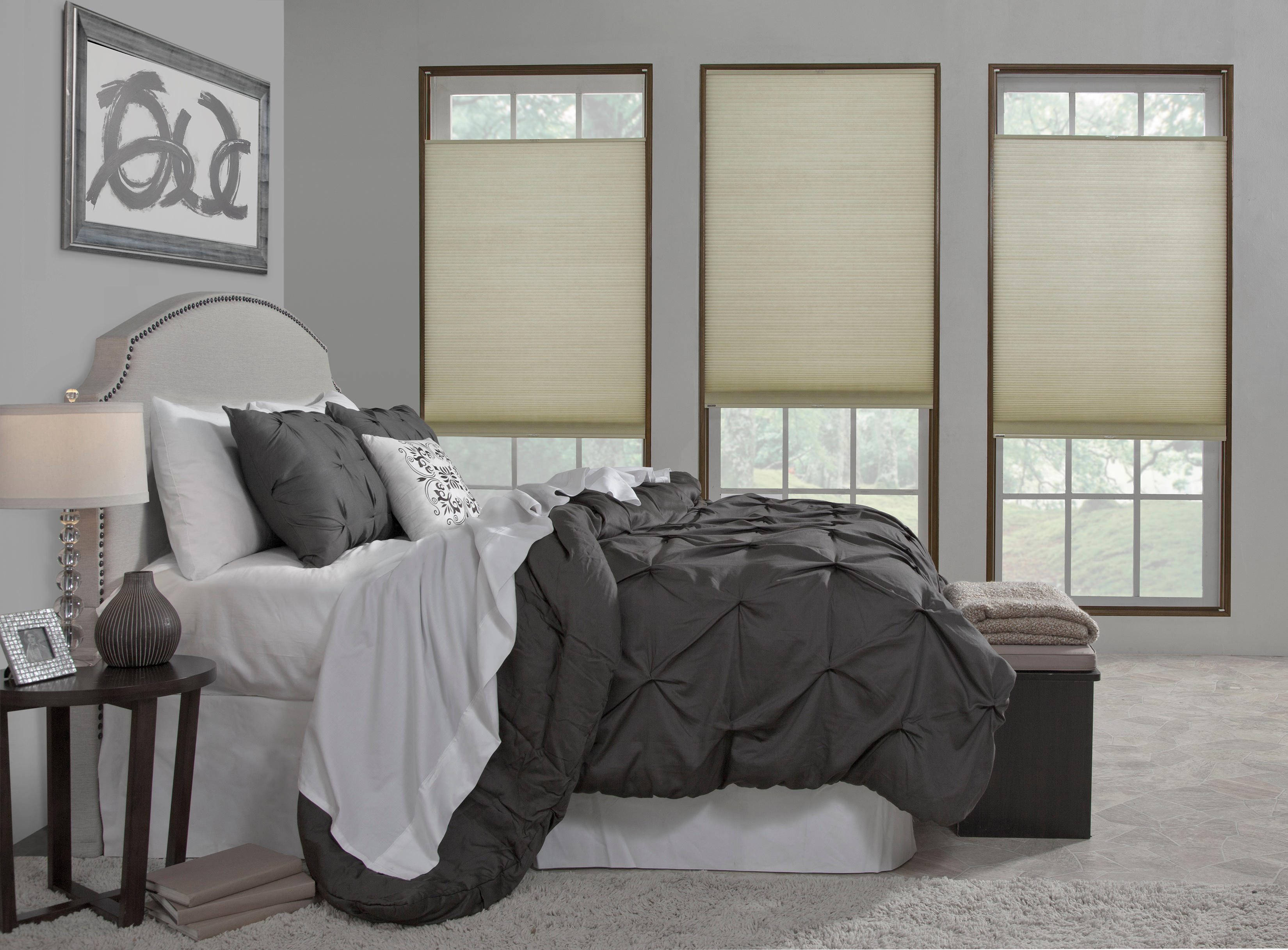 This trio of top-down-bottom-up shades provide the flexibility to open either the upper or lower portion of these honeycomb shades, allowing for the desired amount of light and privacy.