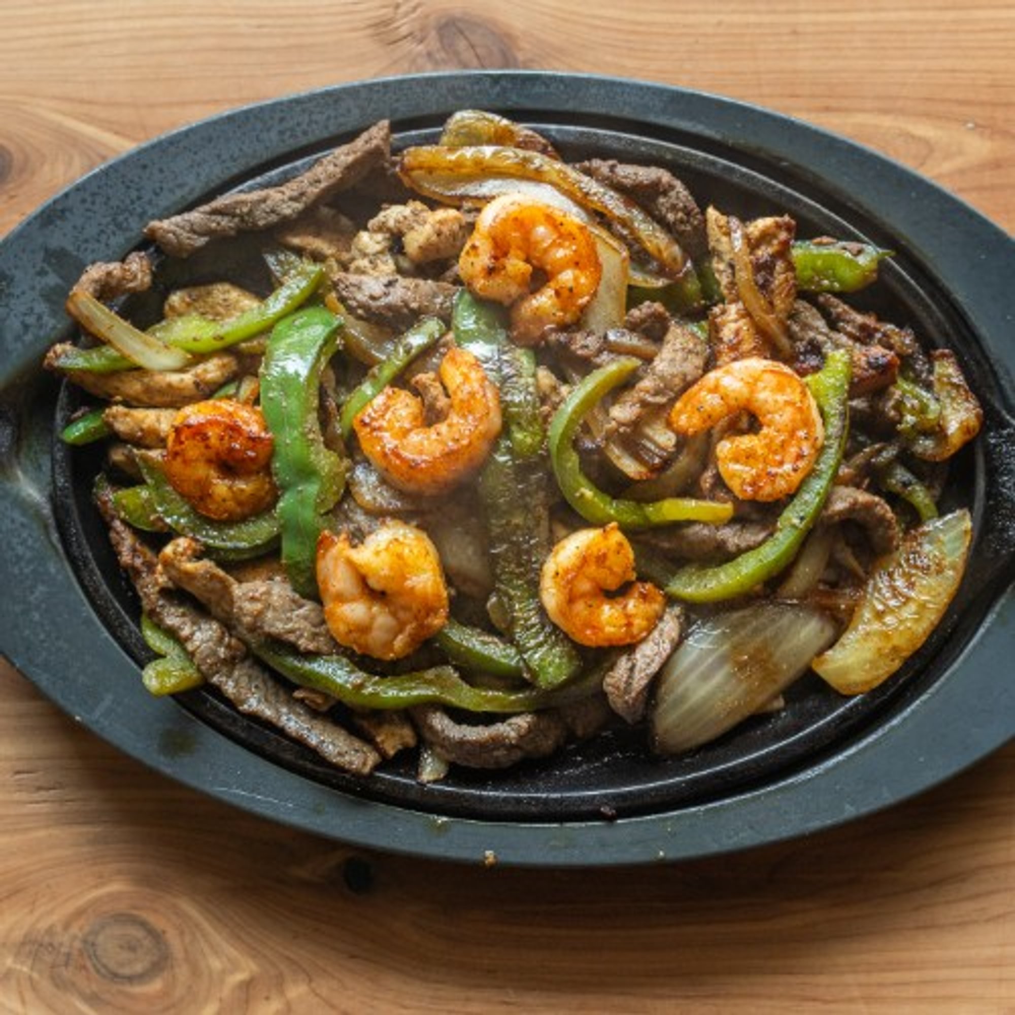 Texas Fajitas Steak, Chicken, & Shrimp