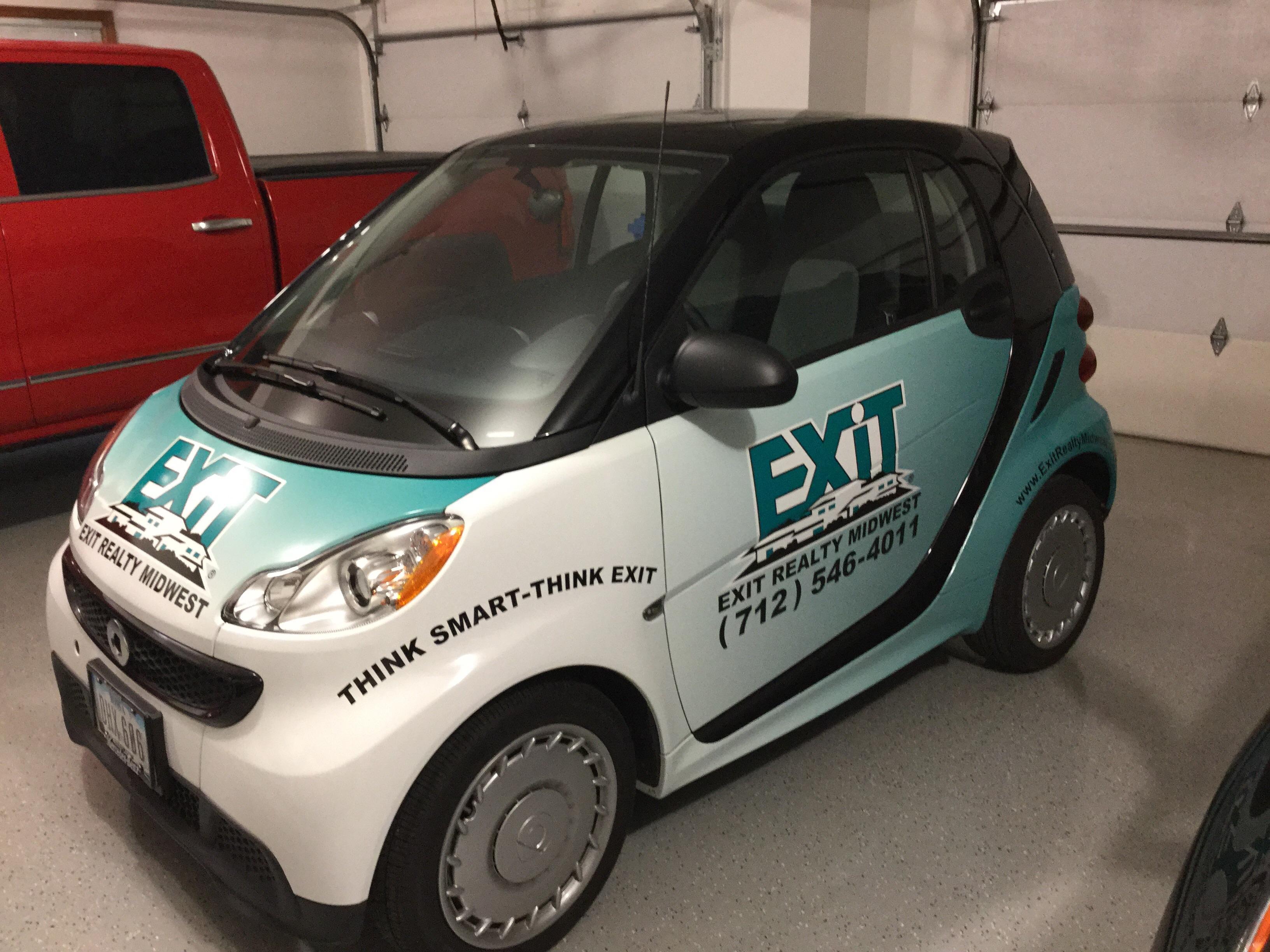 EXIT Realty provides a Mercedes Benz Smart Car for all the special occasions in a realtors day: open houses, parades, chamber events, etc.