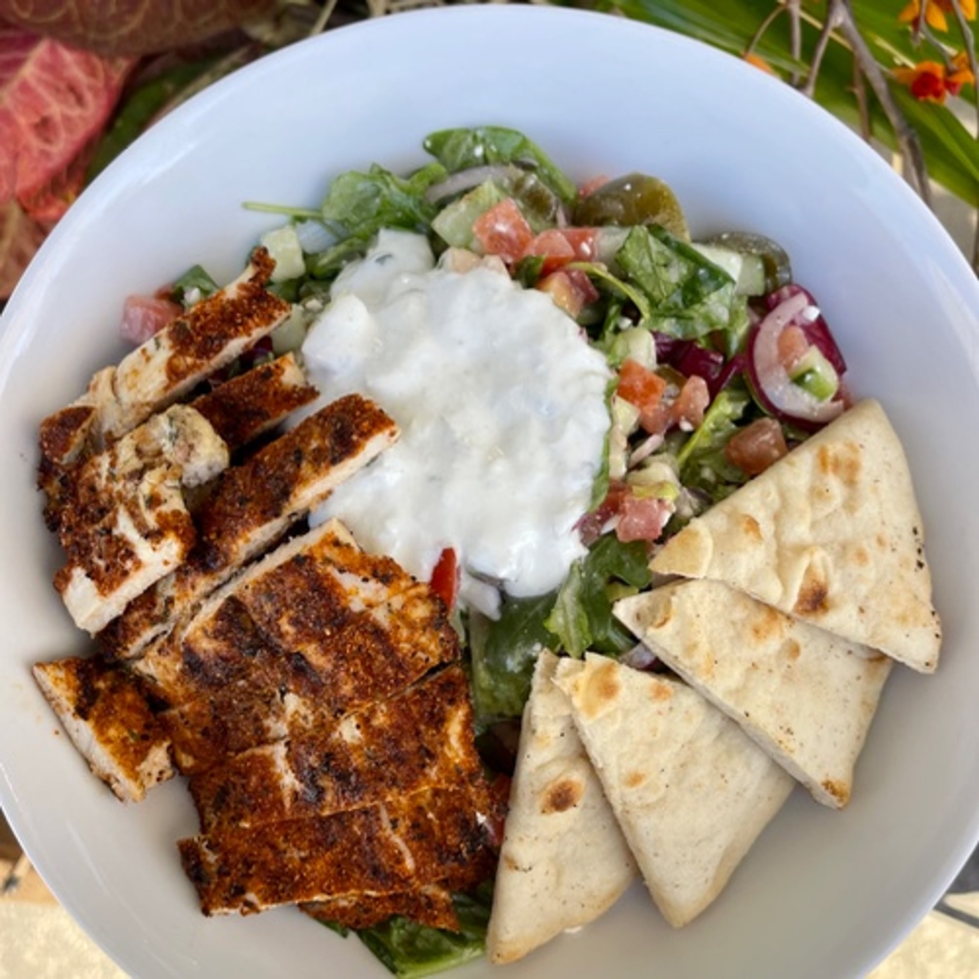 Salted. Greek Salad pictured with blackened chicken