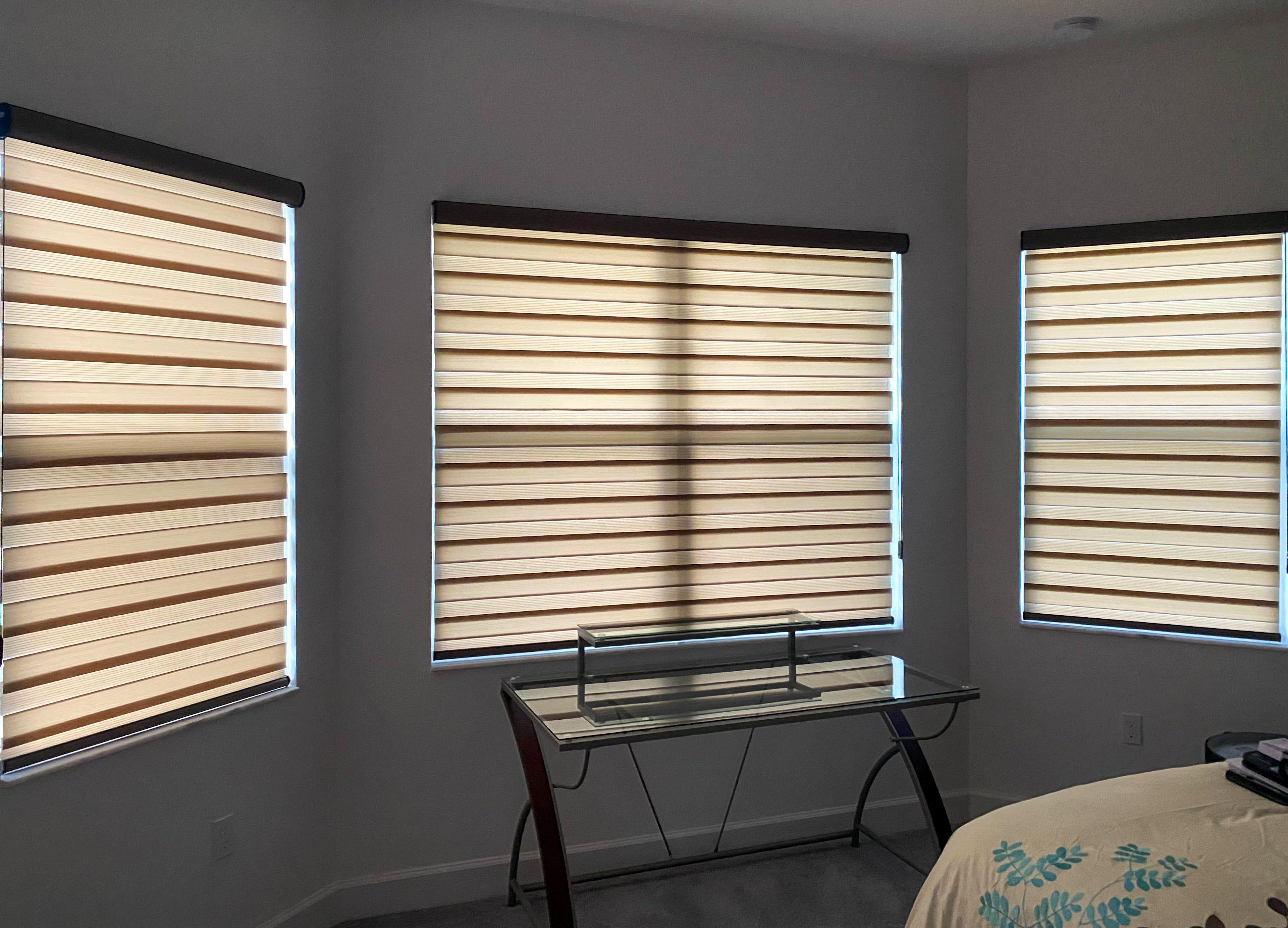 Window treatments have the power to shift a room's mood, and these window shades do just that. Soft, amber-colored light filters in to this Vero Beach bedroom creating a cozy atmosphere.