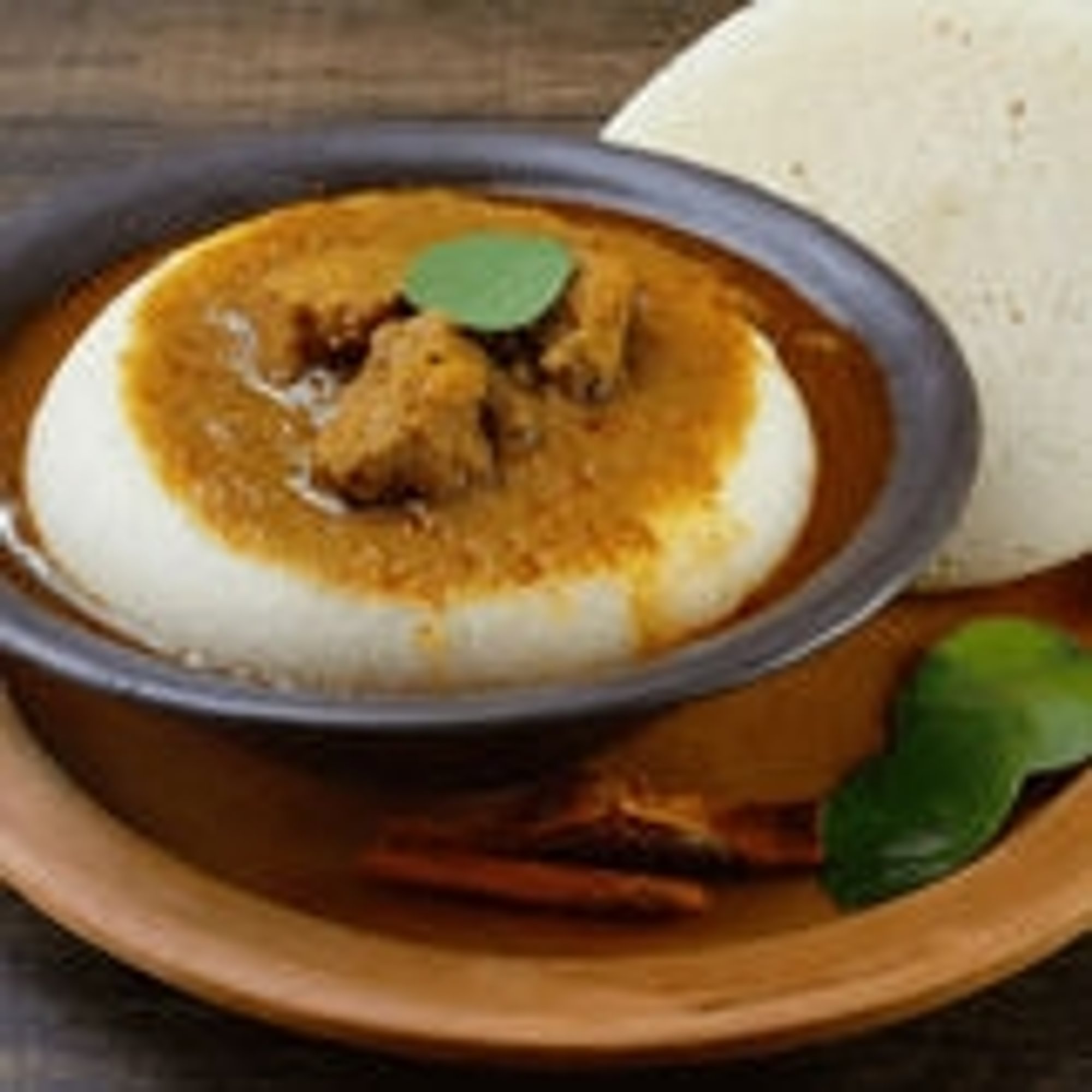 Idli with Mutton Kulambu (Gravy)
