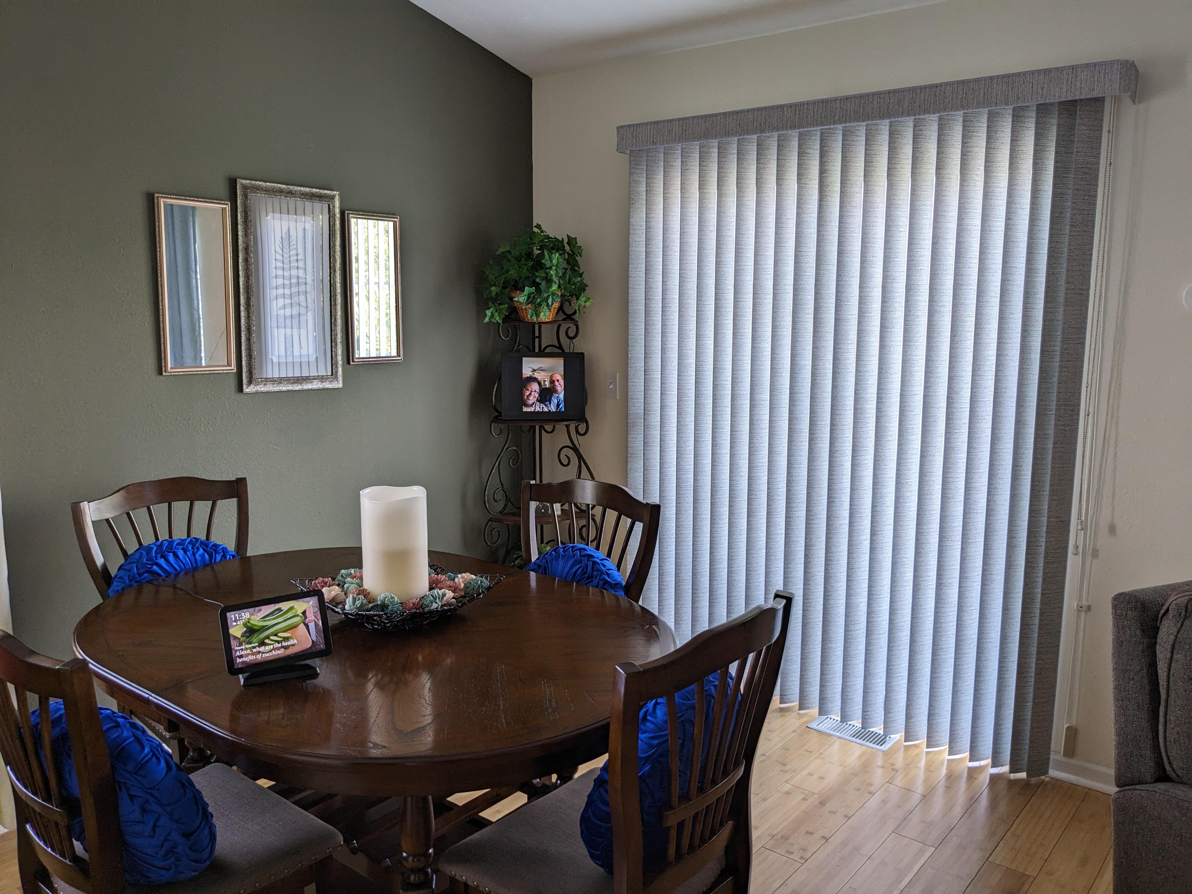 Vertical blinds in Springfield Illinois dining room covering sliding door.  BudgetBlinds  WindowCoverings  Blinds  VerticalBlinds