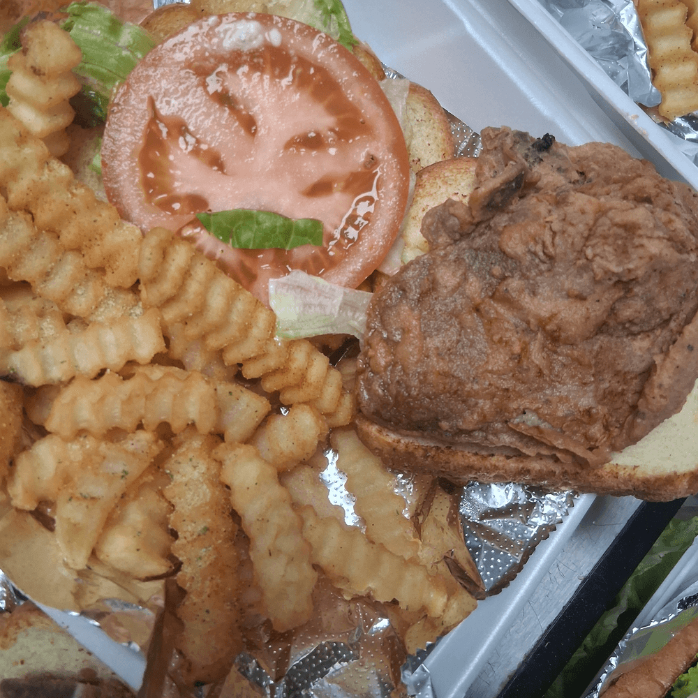 Pork chops with mayo, lettuce tomatoes