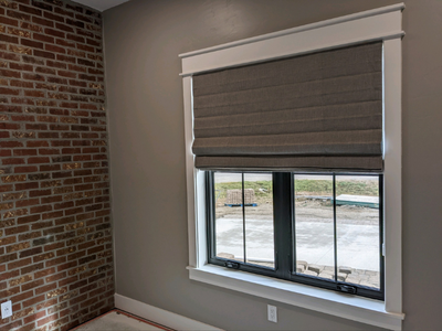 Roman Shades from Budget Blinds of Rock Springs can add an elegant feel to your home.