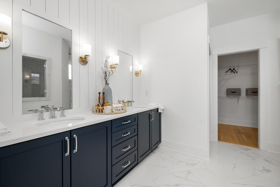 Lavish primary bathrooms with a large walk-in closet